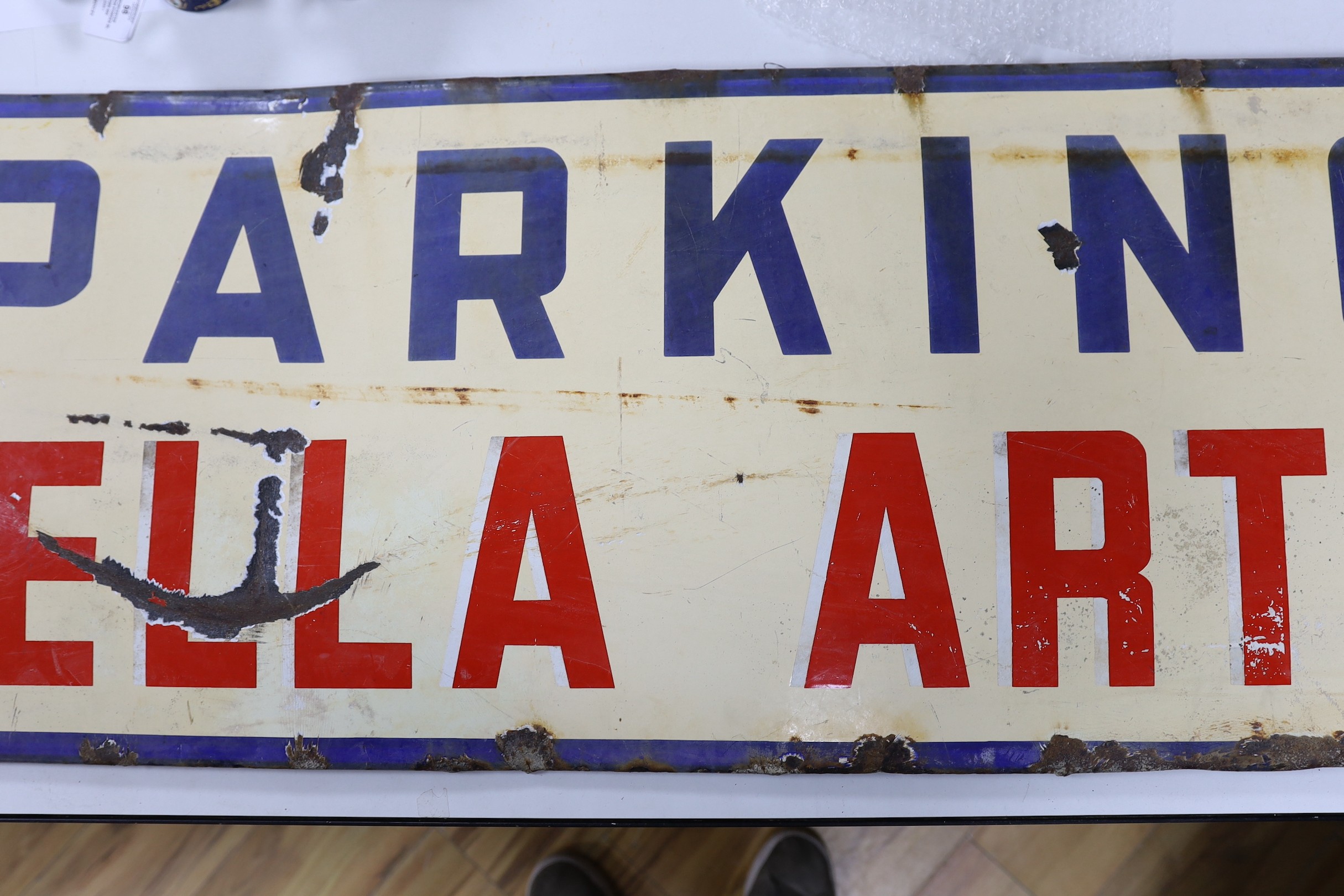 A Stella Artois ‘parking’ enamel sign. 44 x 148cm